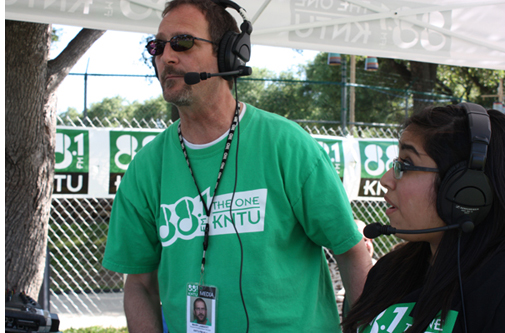Mark Lambert broadcasting with a student from the 2014 Denton Arts & Jazz Festival.